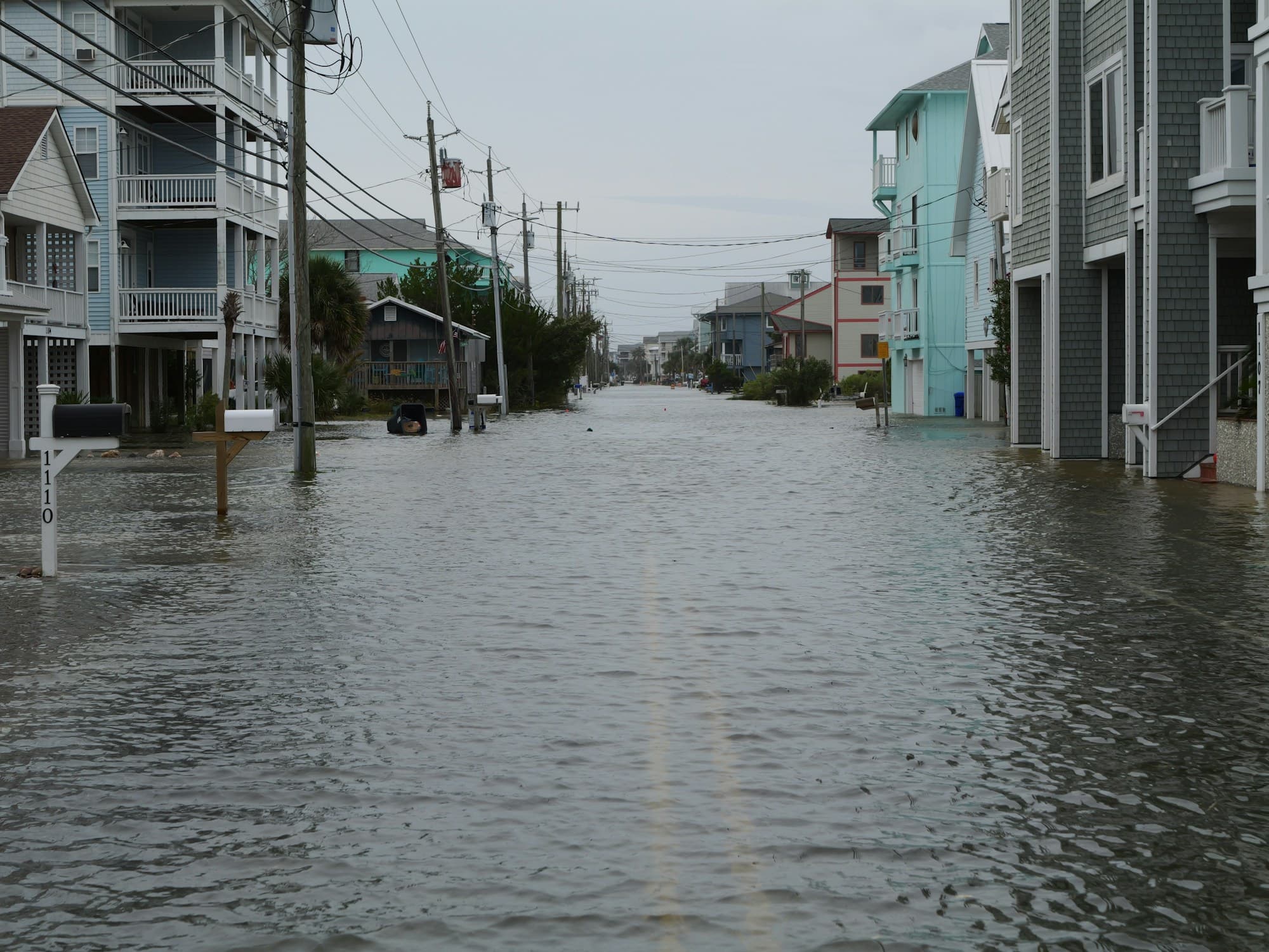 Stock photograph of floodwater covering a residential street